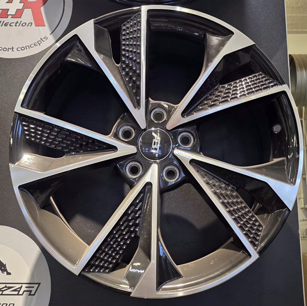 Black alloy wheel with shiny accents