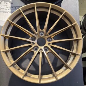 Gold alloy wheel with intricate design
